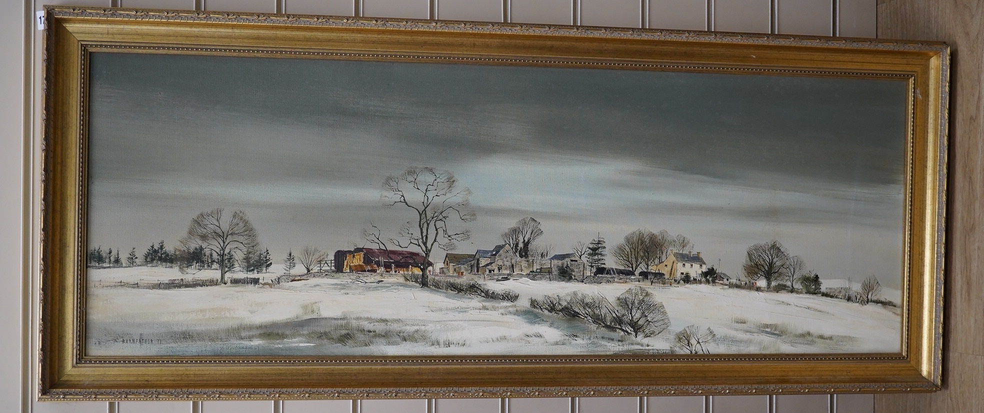 Michael Barnfather (b.1934), oil on canvas, Winter landscape with farm buildings, signed and dated '71, 37 x 105cm, gilt framed. Condition - good